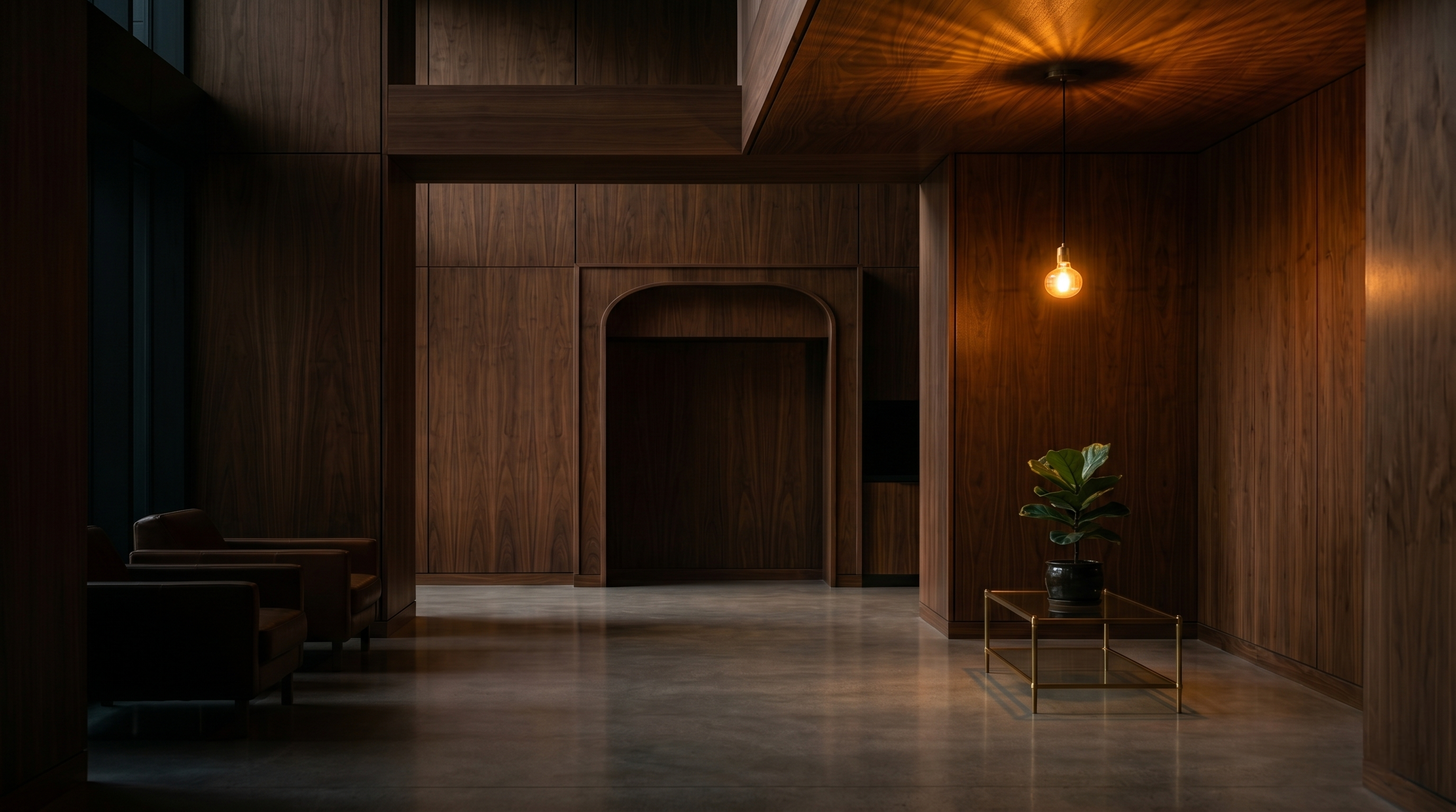 A premium hotel lobby with walnut paneling, brushed brass details, and a single lounge chair — the kind of space where a Hunger Ending Vending machine belongs.
